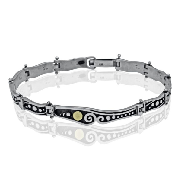 Этнический серебряный браслет с золотыми вставками